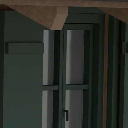 Painted green timber, seen close up on the chalet
